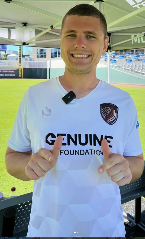 A United Genuine FC player showing the club’s white Admiral jersey